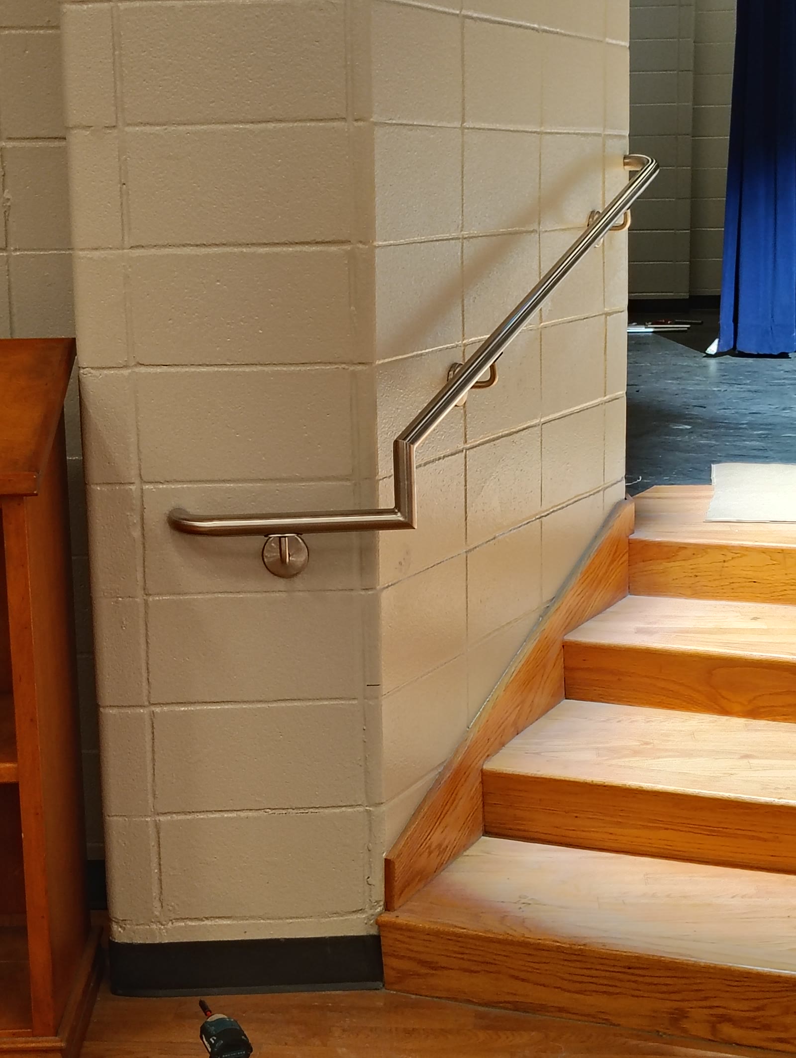 Stainless steel handrail on stair wall