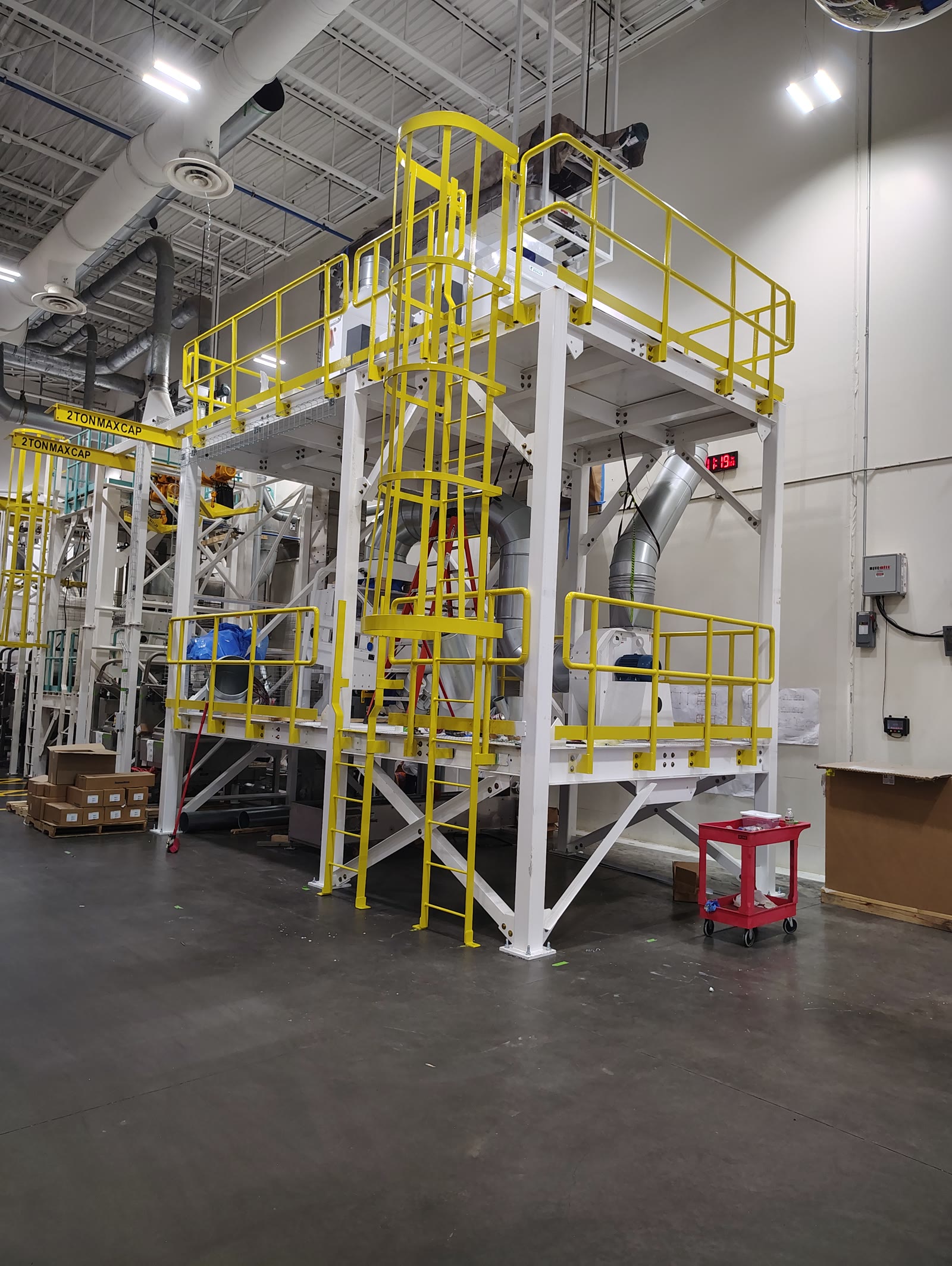 Industrial mezzanine with yellow safety rails